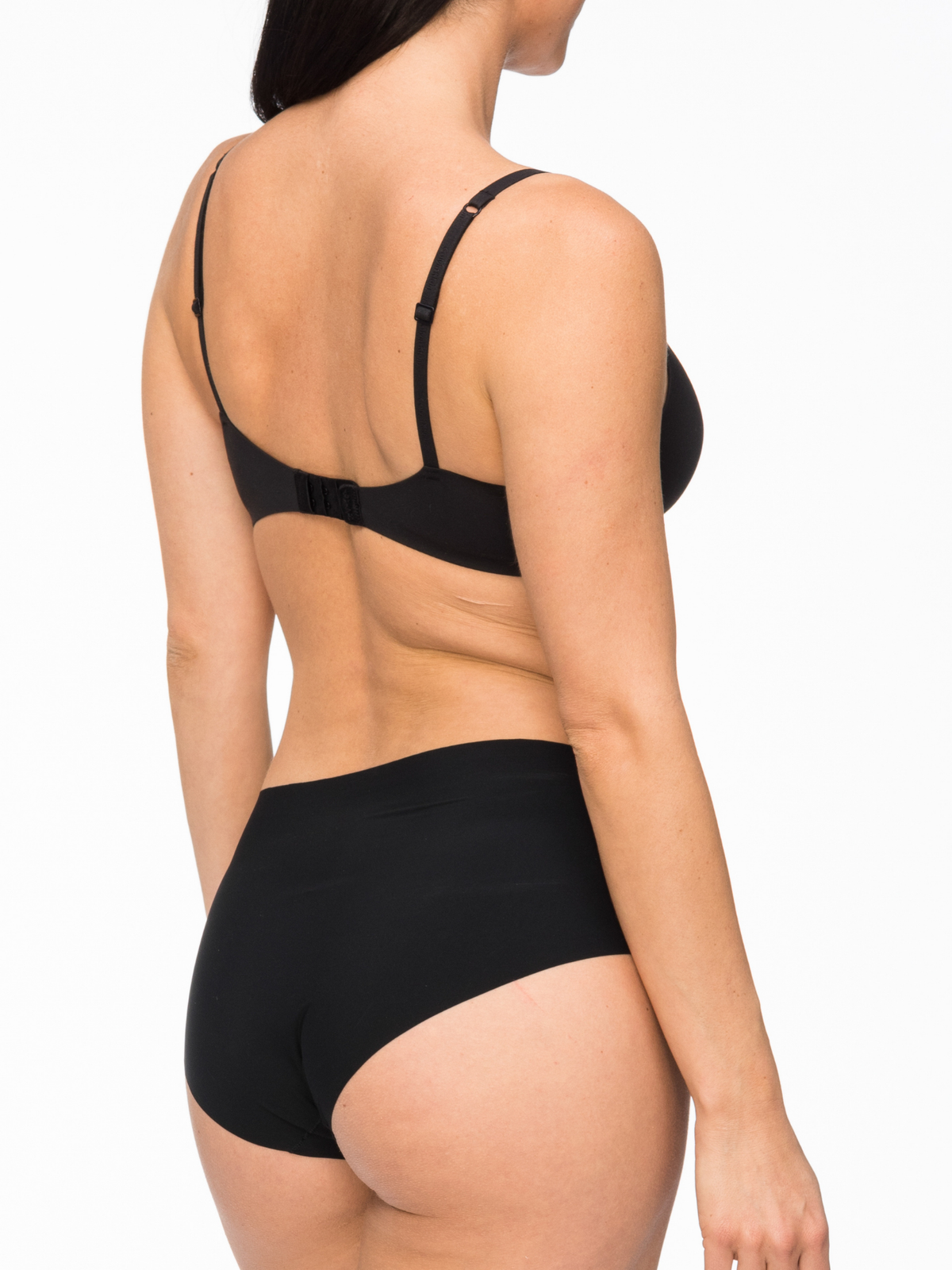 Back profile of Nancy Ganz Body Light Waisted Brief with flat bonded seams and laser cut edges for seamless shaping.