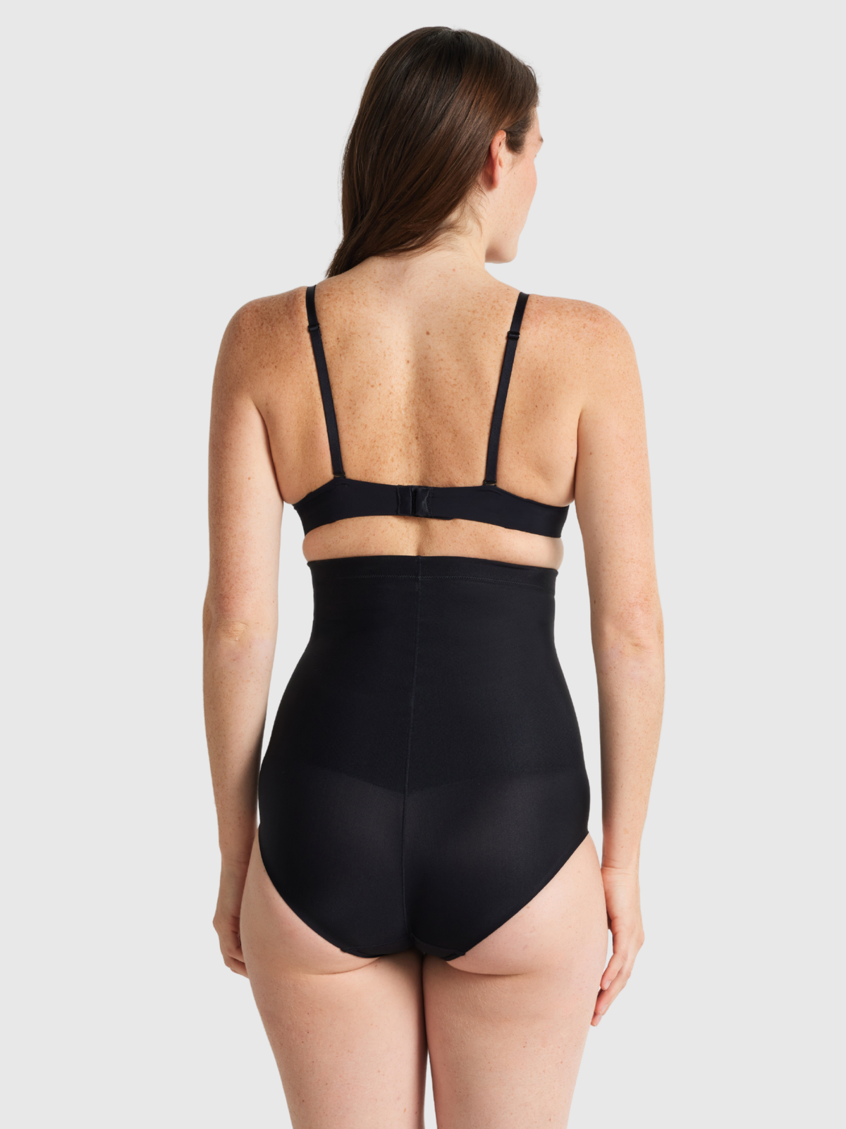 Nancy Ganz X-Factor High Waisted Brief in black, back view showing full rear coverage and seamless leg edge.