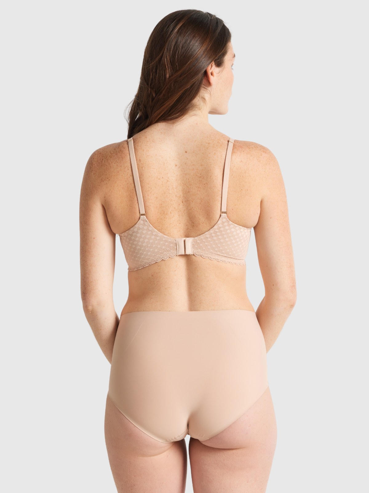 Back view of Nancy Ganz Revive Smooth Waisted Brief designed with flat smooth edges for no visible panty lines.