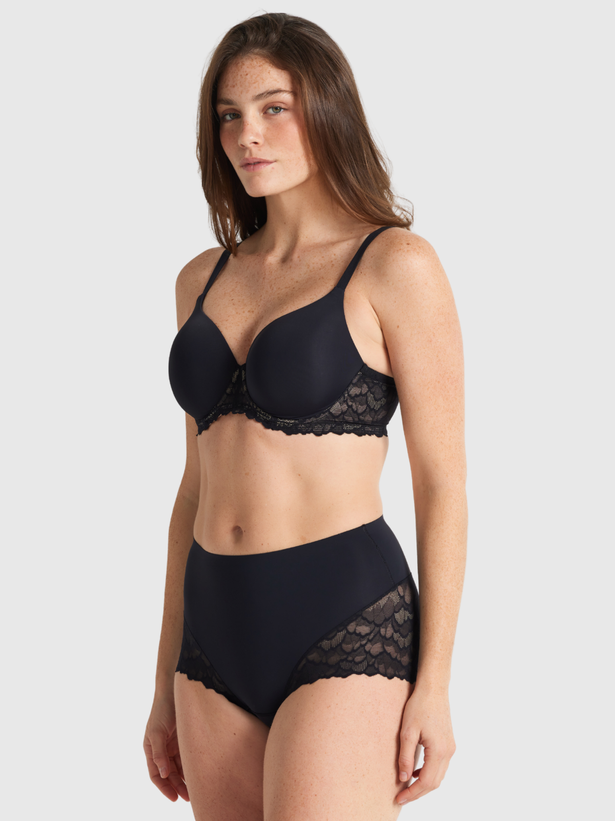 Nancy Ganz Sculpted Lace Waisted Brief in black, side view, showing smooth contouring and lace waistband detail