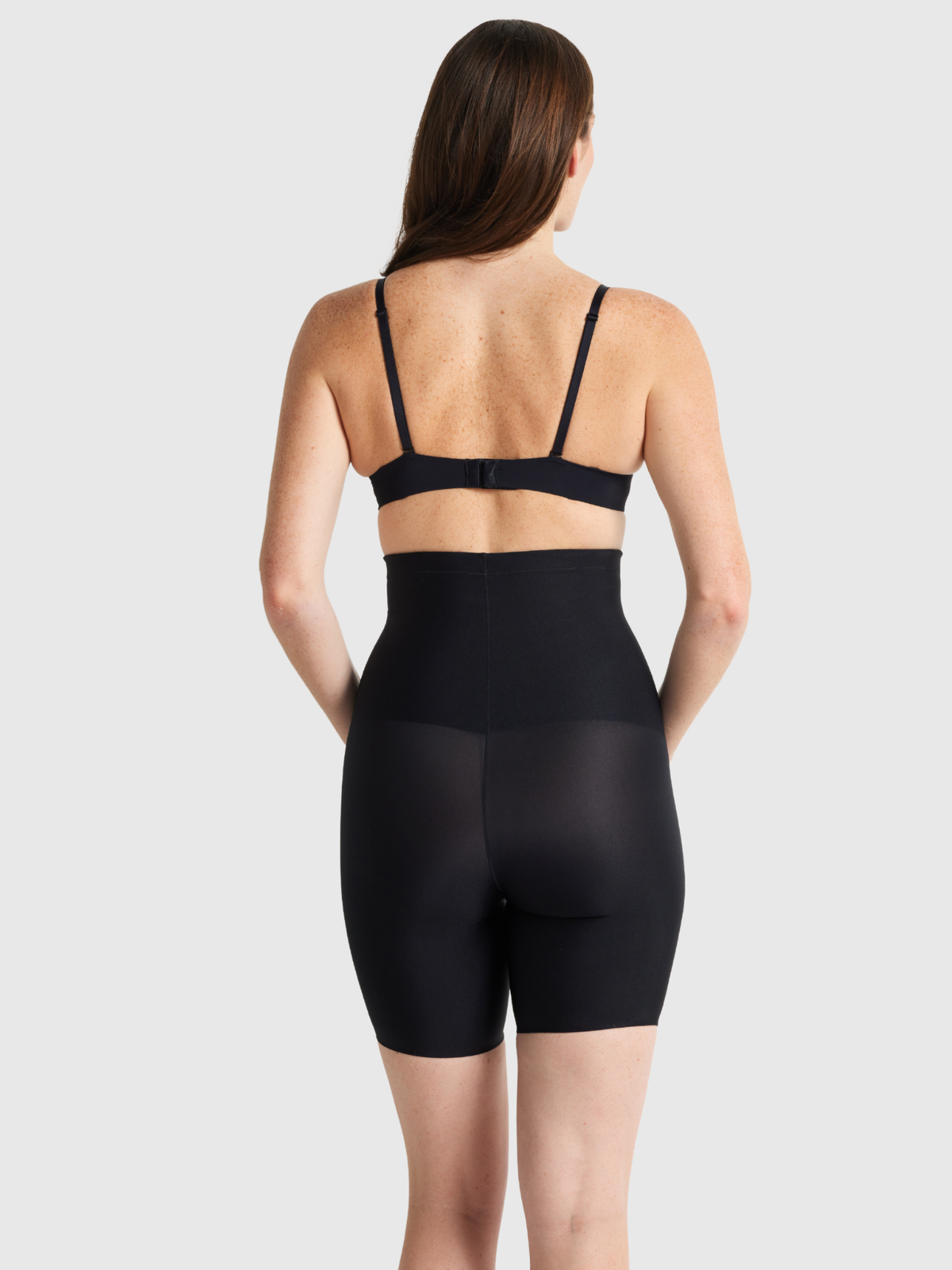 Nancy Ganz X Factor High Waisted Thigh Shaper in Black – back view showing seamless shaping panel and finish