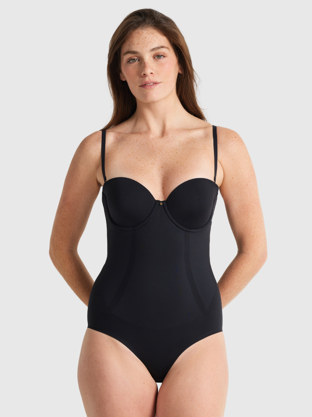 Front view of Nancy Ganz Body Define Strapless Bodysuit showing seamless contour cups and smooth bonded panels for waist and hip shaping.