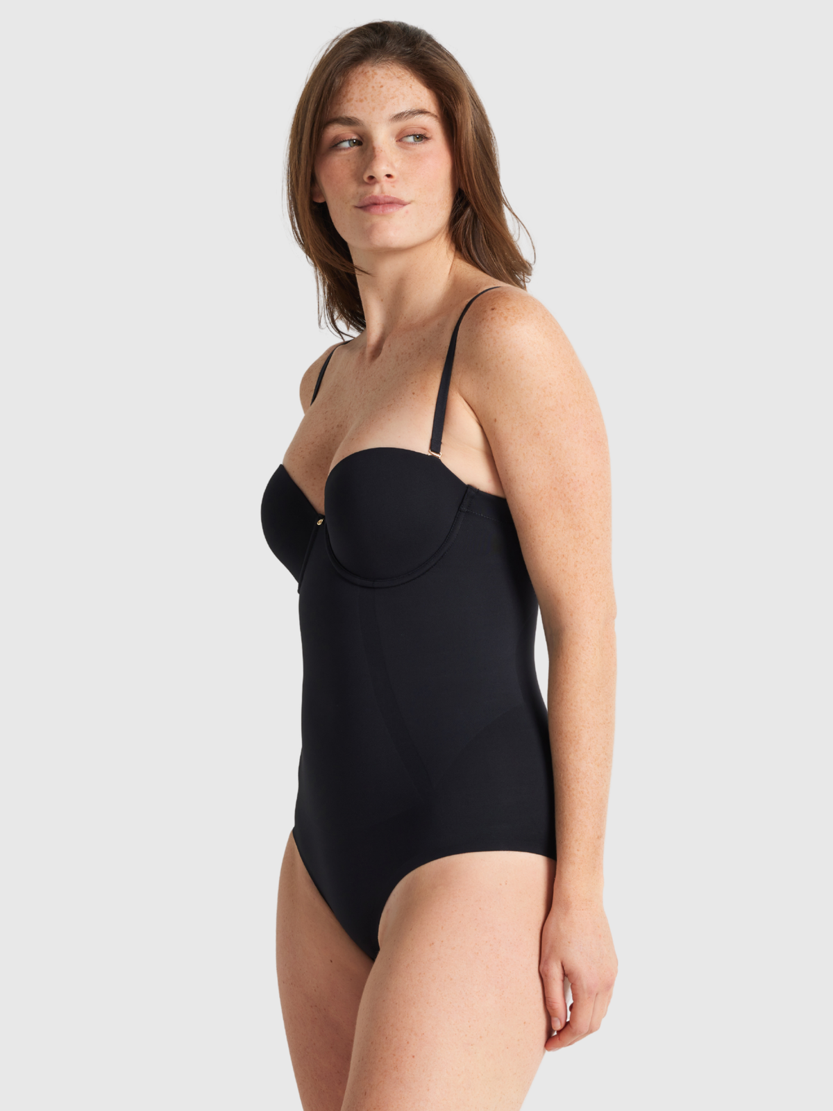 Side view of the Body Define strapless bodysuit showing seam-free Flex to Fit pads for natural bust shape and support.
