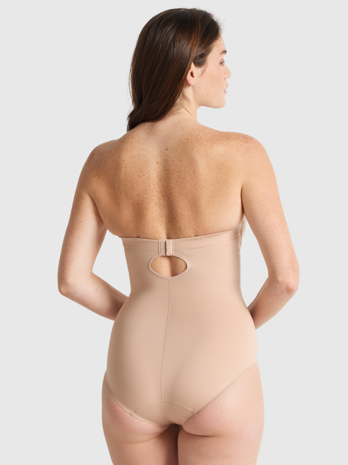 Back view of Nancy Ganz Body Define Strapless Bodysuit showing detachable straps that can be removed.