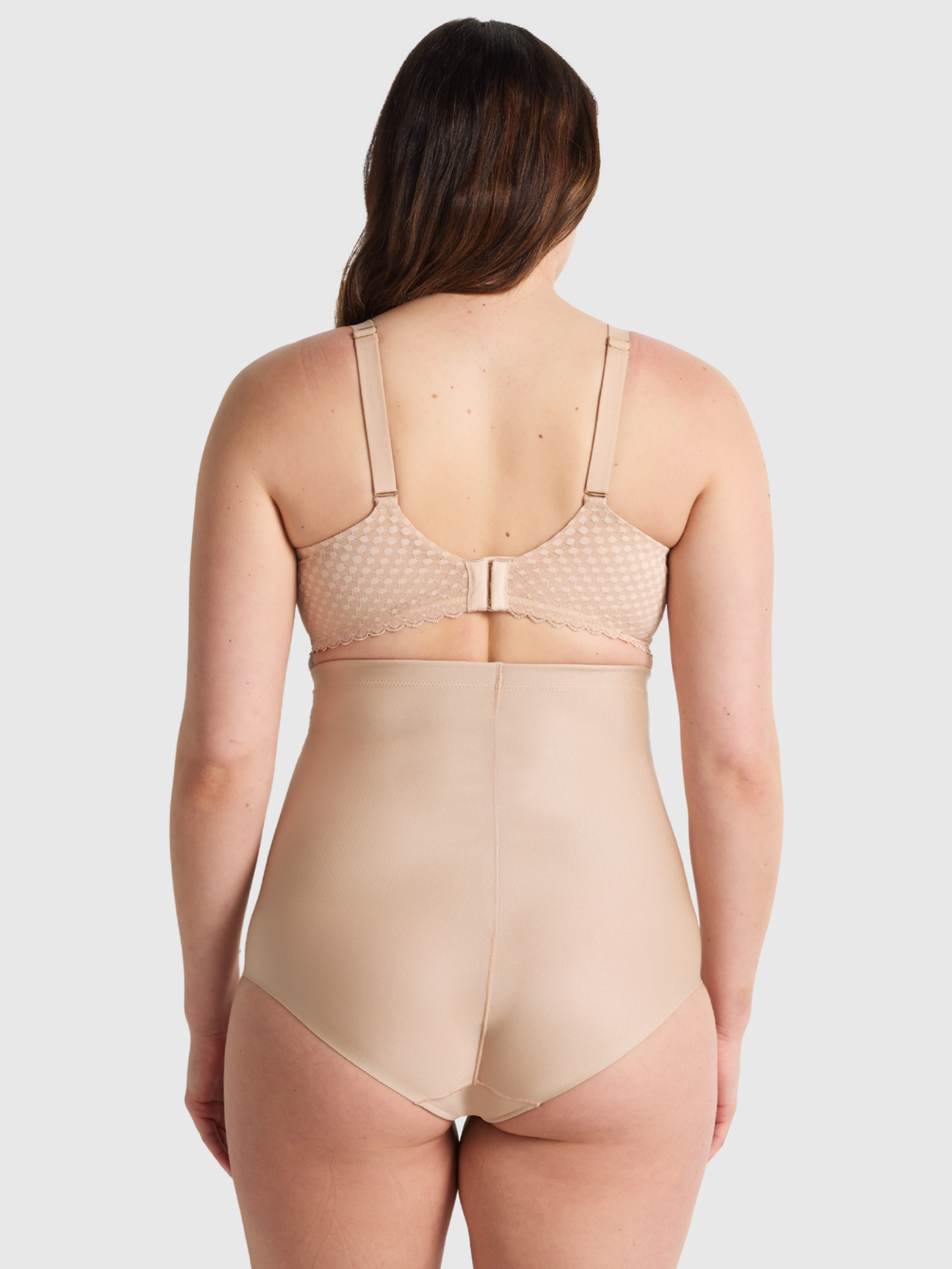 Back view of Nancy Ganz X-Factor High Waisted Brief highlighting seamless design with secure nano elastic hold.