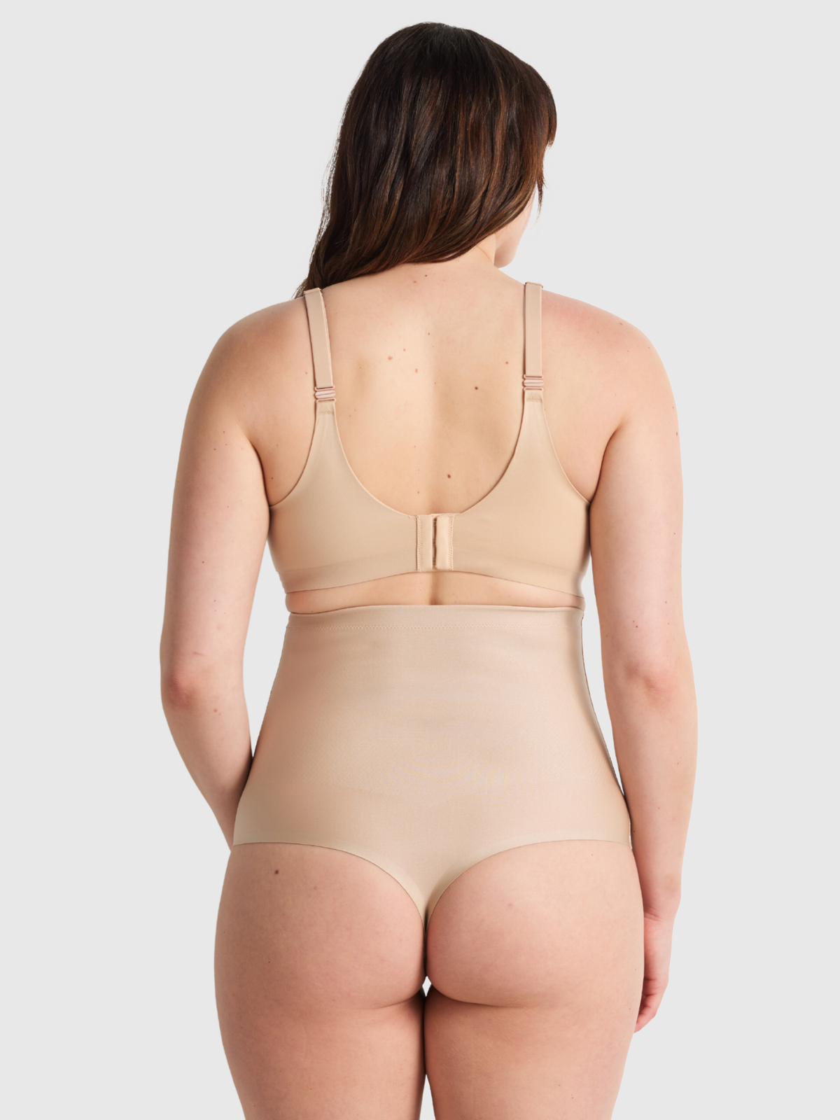 Rear view of Nancy Ganz X-Factor High Waisted Thong showing the no-VPL design with sleek, smoothing back panel and minimal coverage for a seamless look under clothes.