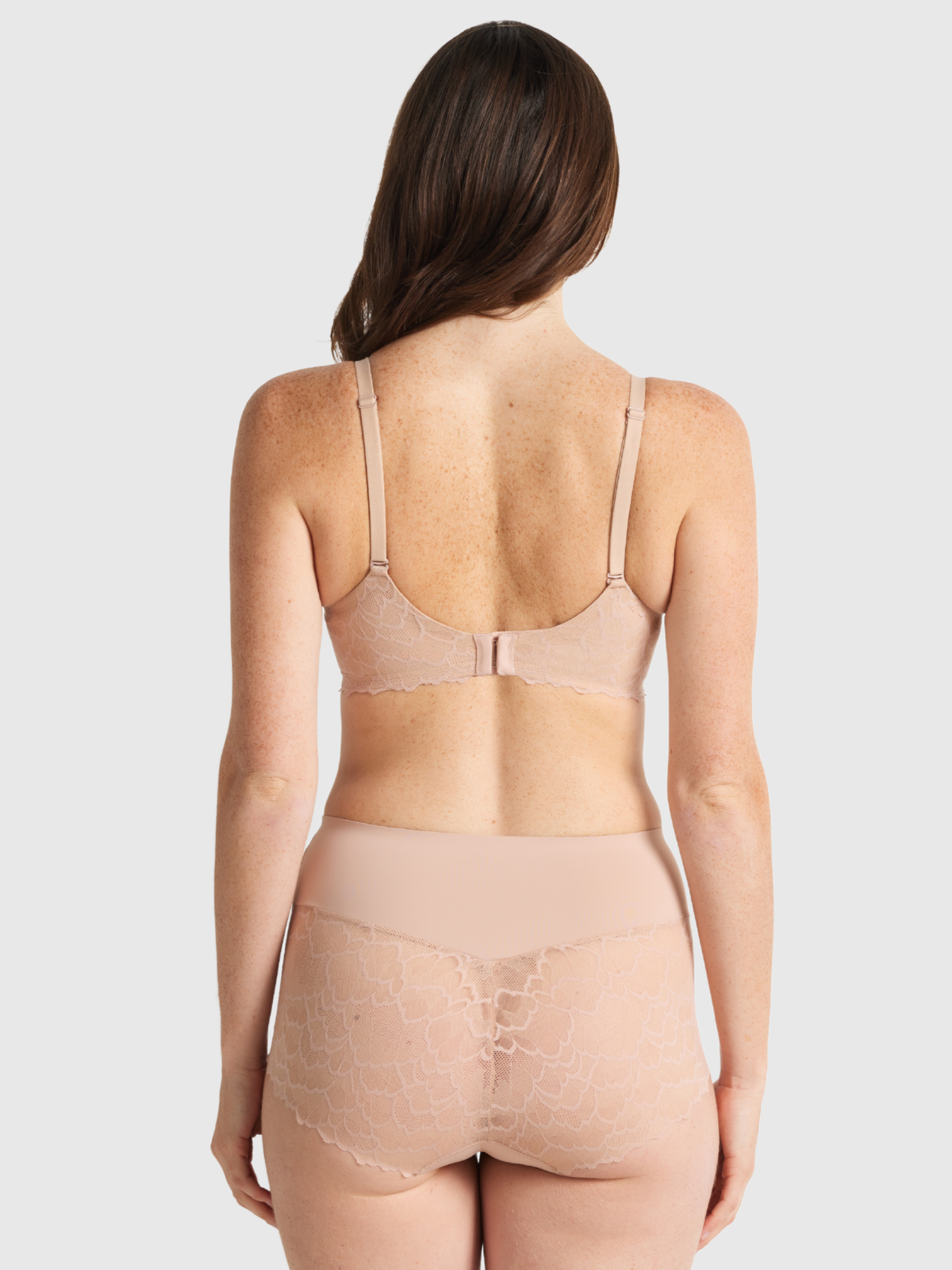 Nancy Ganz Sculpted Lace Waisted Brief in warm taupe, back view, showing seamless shaping and scalloped lace trim