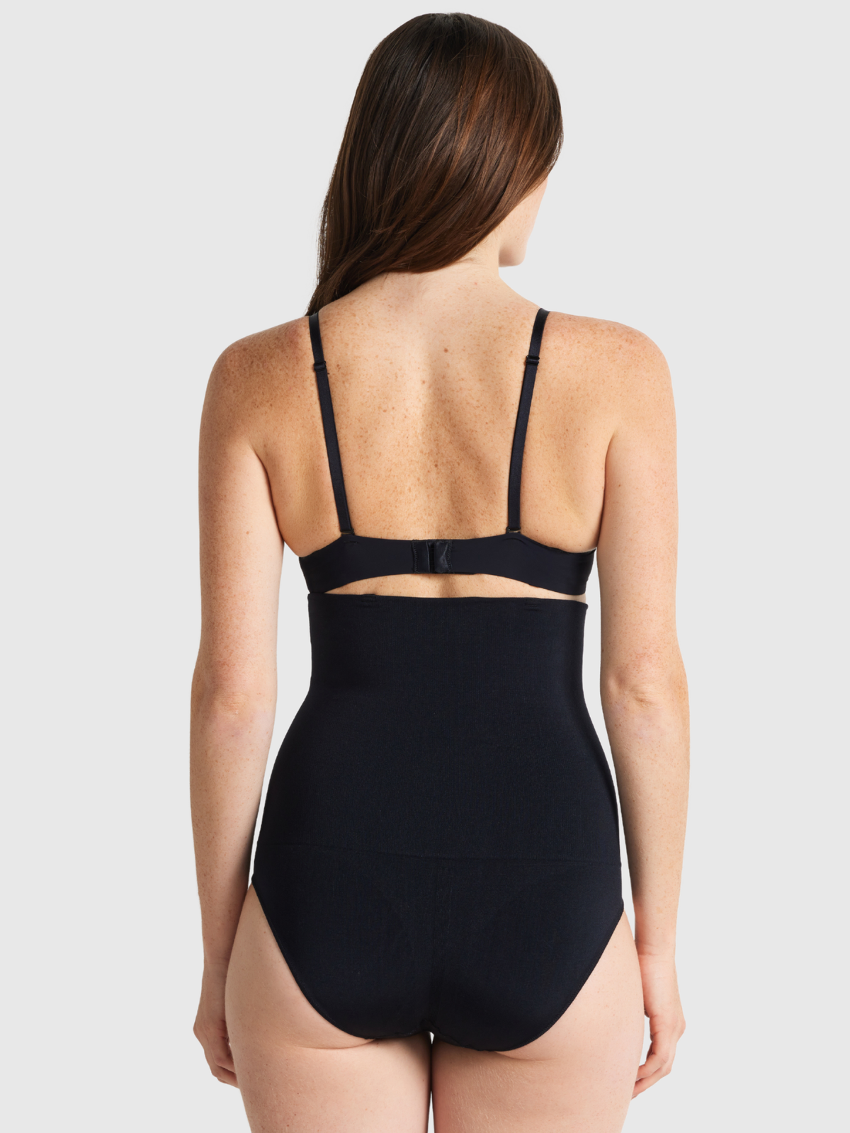 Nancy Ganz Seamless Seduction High Waisted Brief in black, back view showing full seat coverage and seamless bonded edges.