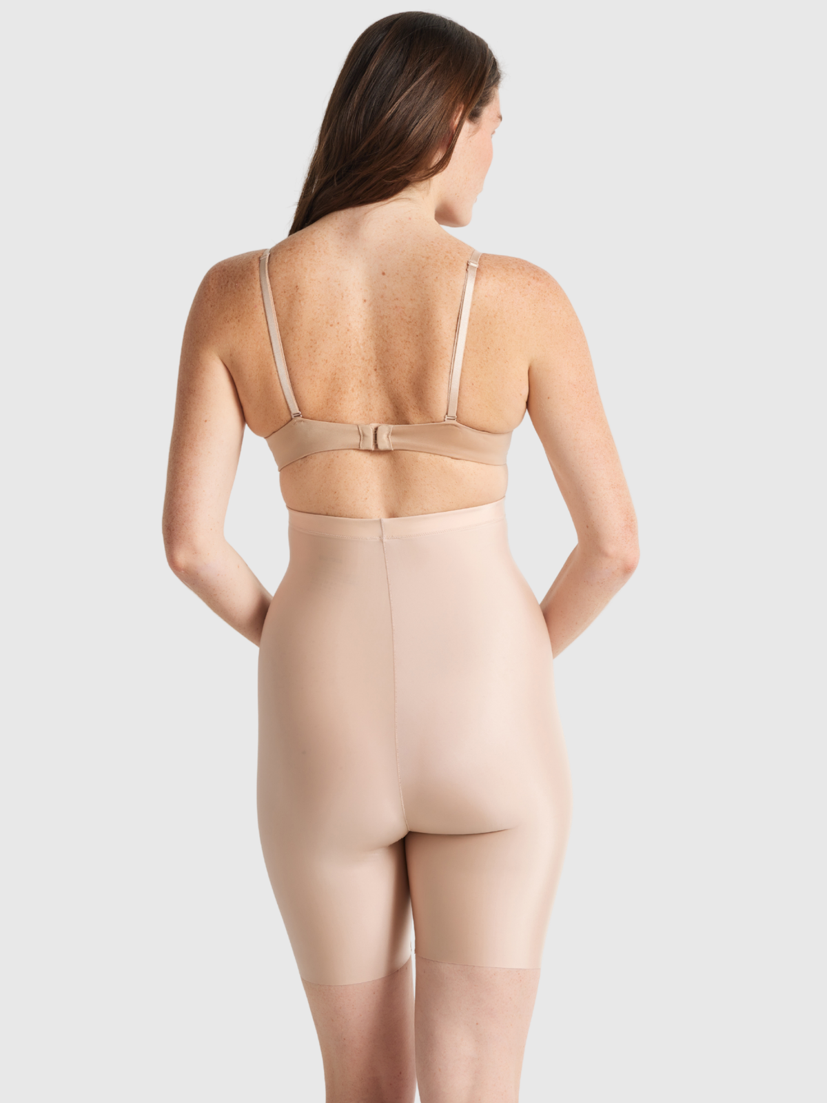 Back profile of NO VPL thigh shaper featuring seamless design, moderate support, and smooth finish under clothes.