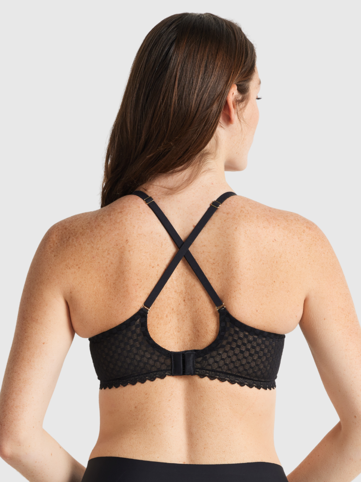 Eco-friendly Nancy Ganz bra crafted from recycled nylon with versatile strap options.